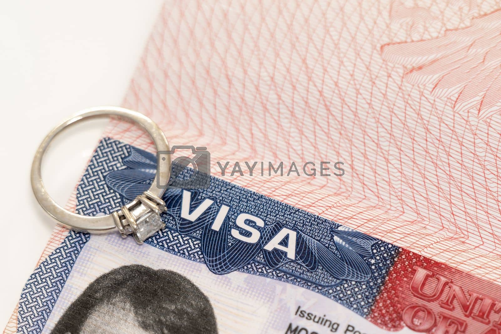Royalty free image of Concept photo for fiance visa and US immigration with diamond ring by sdf_qwe