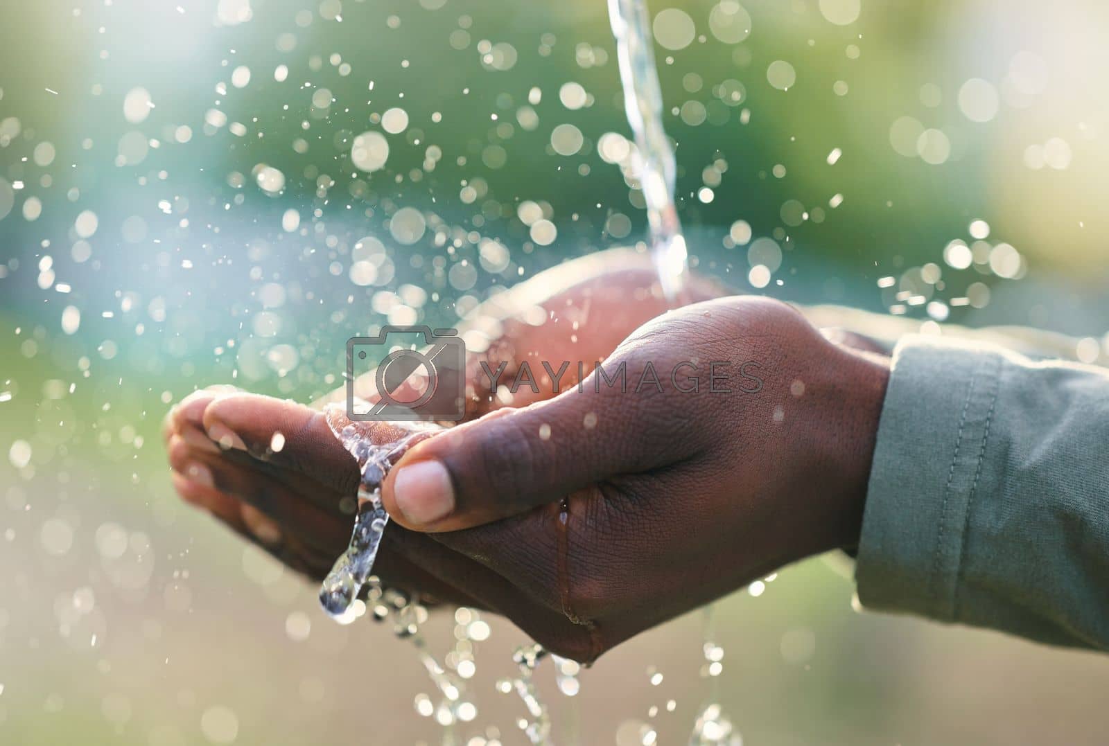 Royalty free image of Hands, splash and man with water in nature for outdoor washing, cleaning or body hygiene. Natural, organic and African male hand with aqua to wash or clean to prevent germs, dirt or dust outside. by YuriArcurs