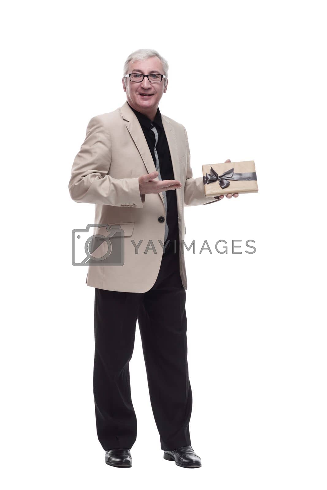 Royalty free image of in full growth. Mature intelligent man with a gift box. by asdf
