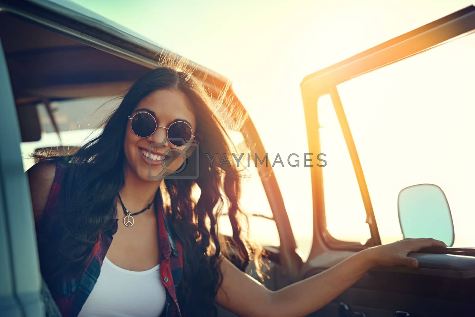 Royalty free image of Full tank and the weather is fine. Its roadtrip time. a young woman enjoying a relaxing roadtrip. by YuriArcurs