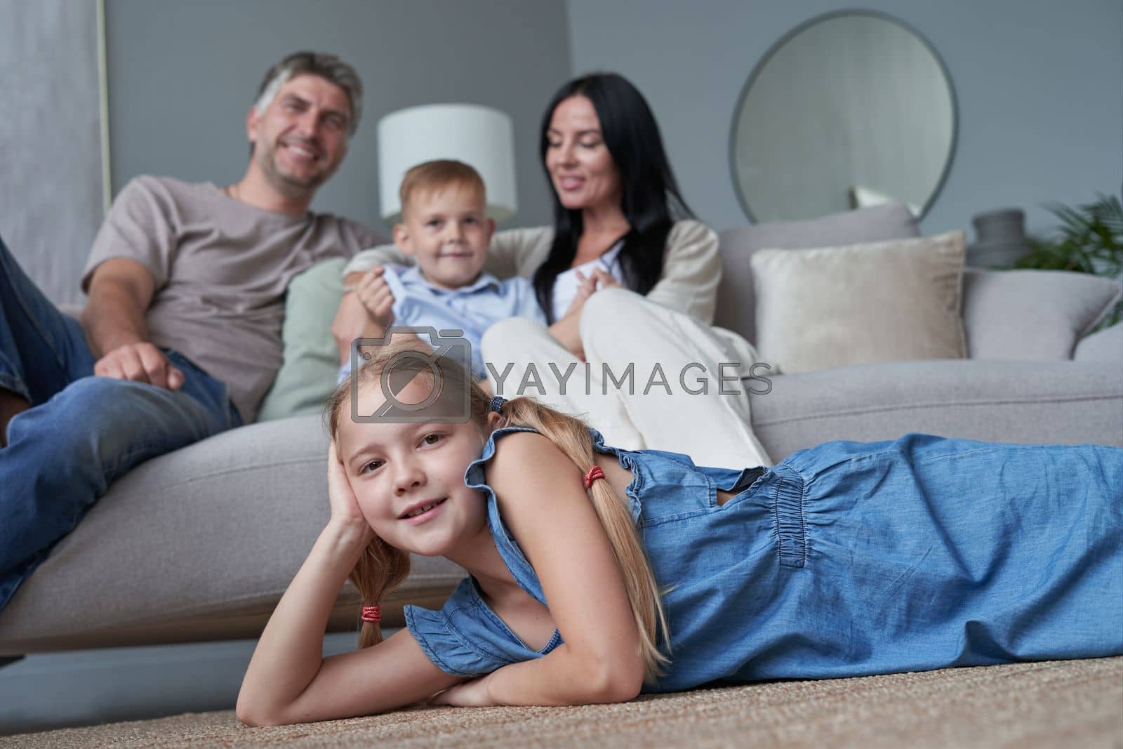Royalty free image of happy family mother father and children at home by asdf