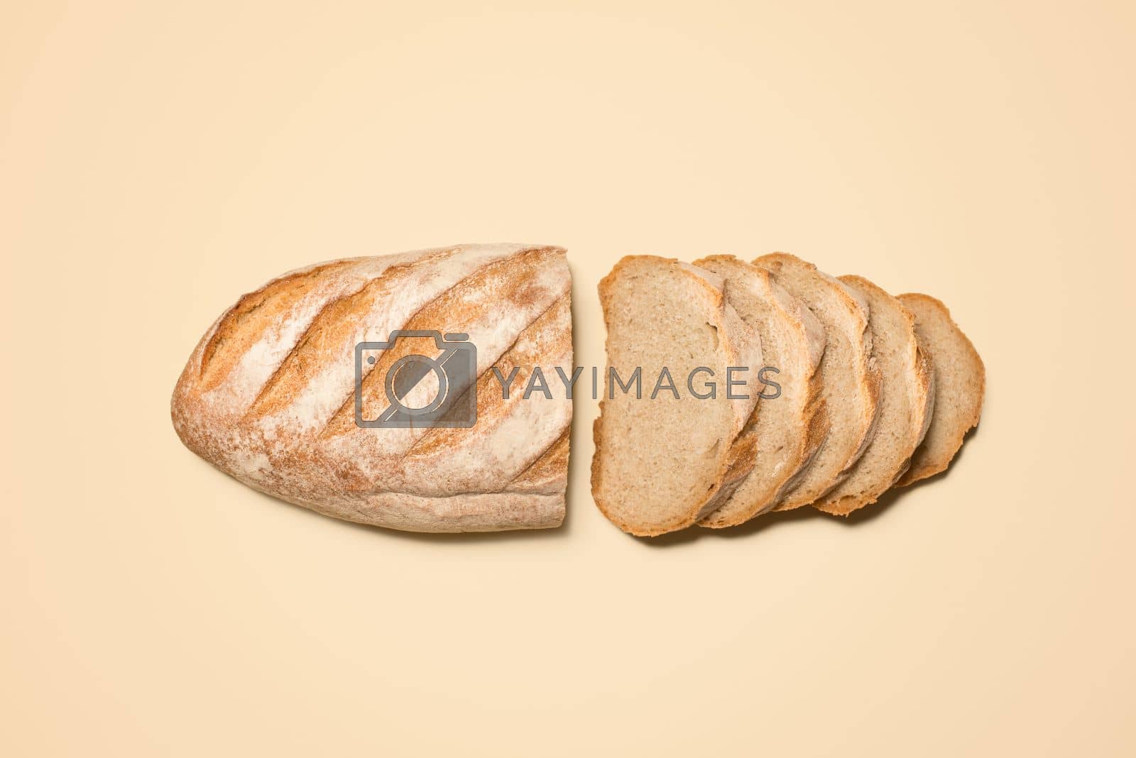 Royalty free image of Baked to absolute perfection. a loaf of bread against a studio background. by YuriArcurs
