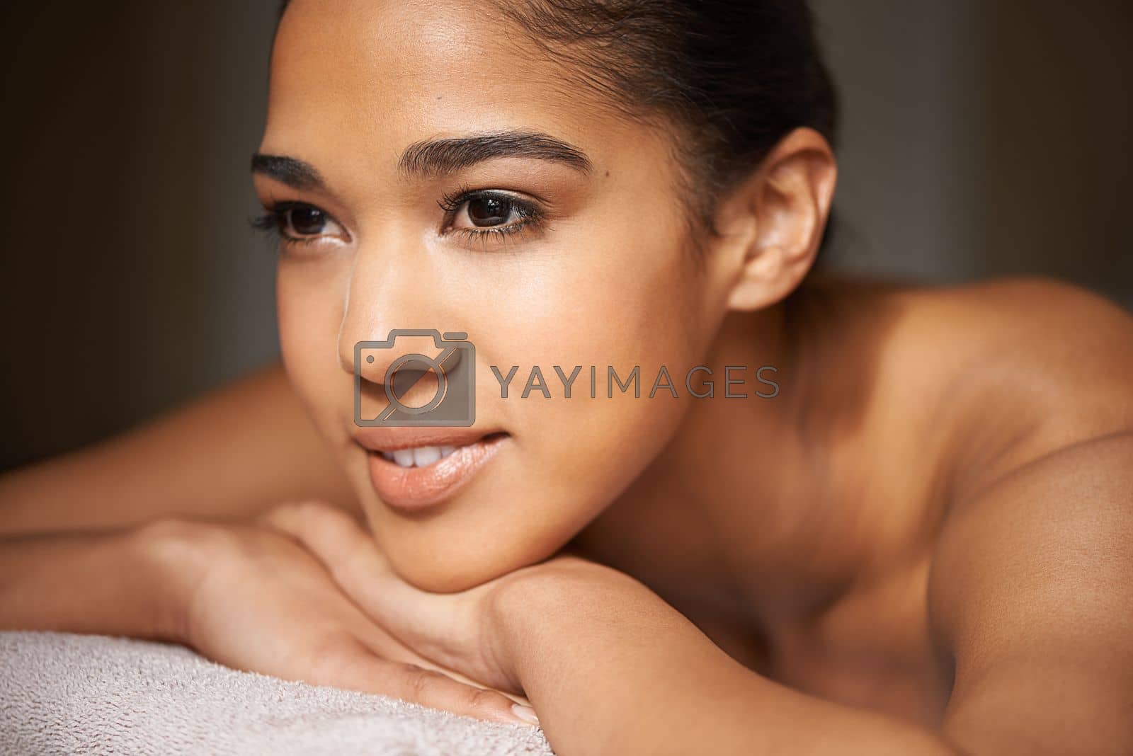 Royalty free image of Treating herself to a well-deserved spa day. a beautiful young woman relaxing during a spa treatment. by YuriArcurs