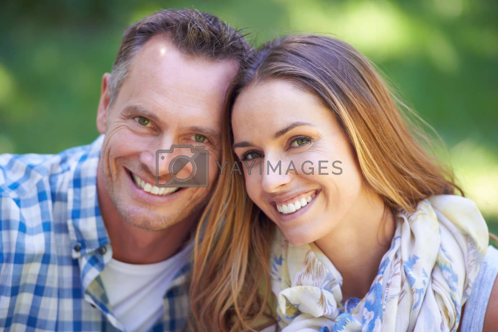 Royalty free image of They love spending time outdoors. Portrait of an affectionate couple in the outdoors. by YuriArcurs