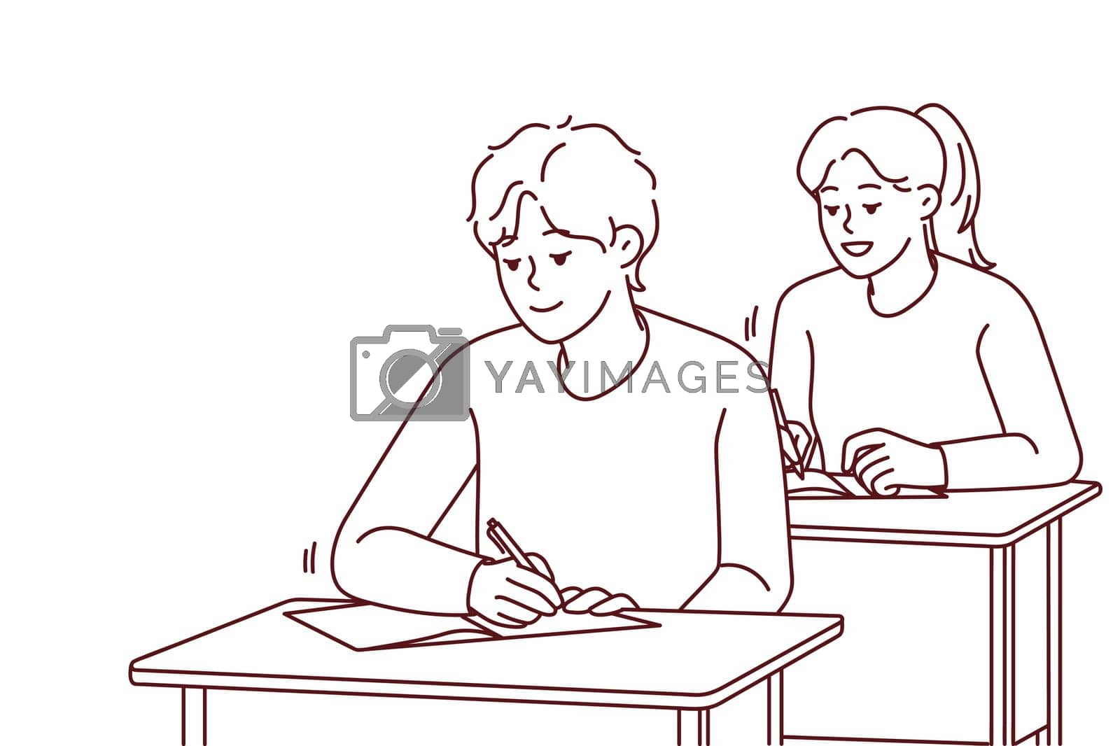 Royalty free image of Smiling students sit at desk writing at lesson by Vasilyeva