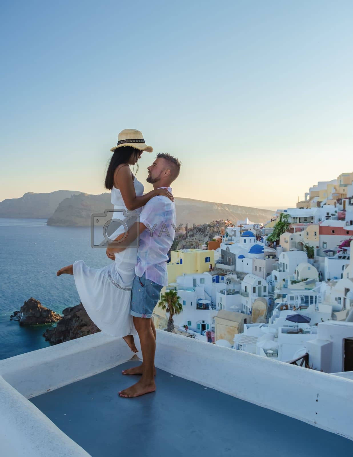 Royalty free image of Couple on vacation in Santorini Greece, men and women at the streets of the Greek village of Oia by fokkebok