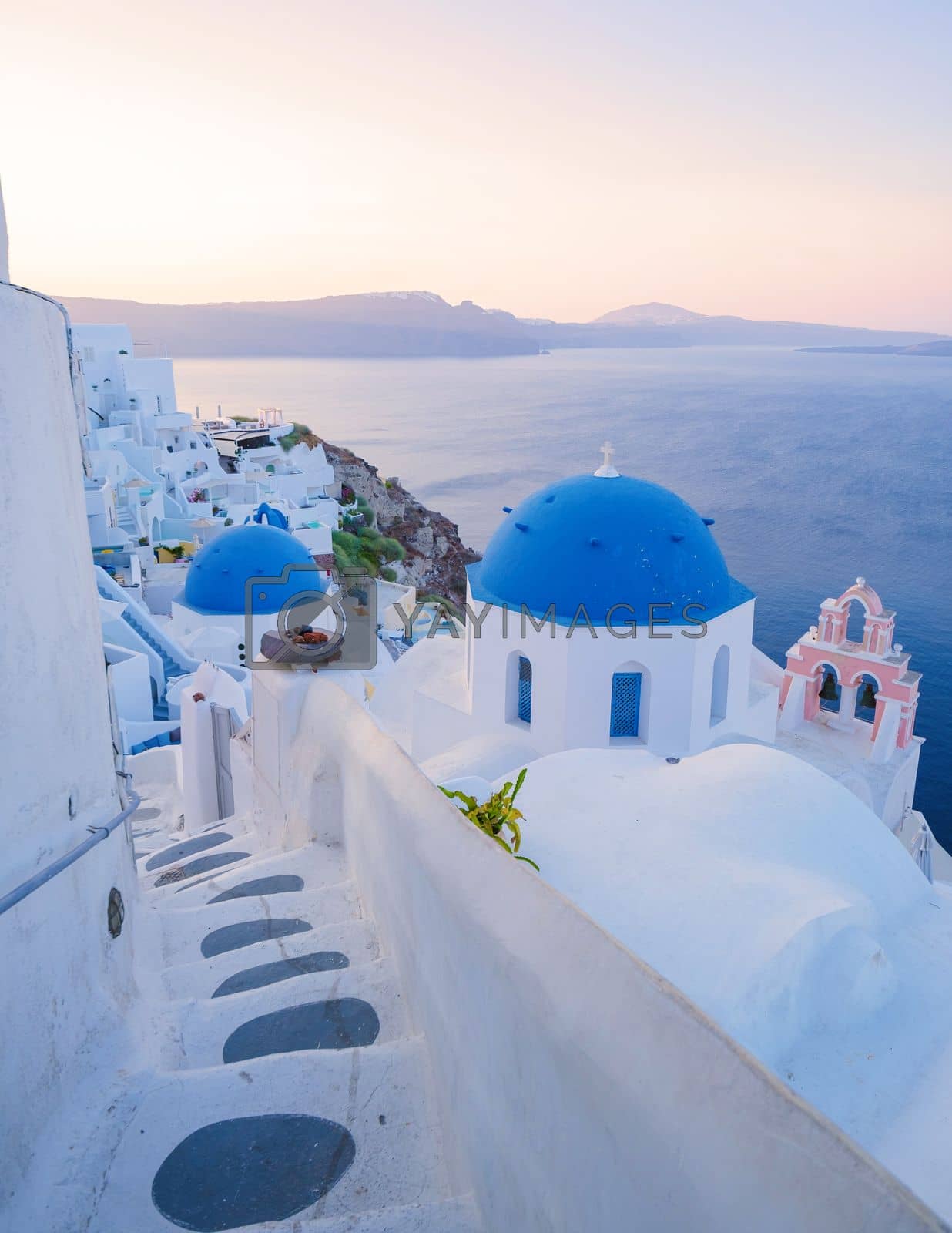 Royalty free image of sunrise by the ocean of Oia Santorini Greece, traditional Greek village by fokkebok