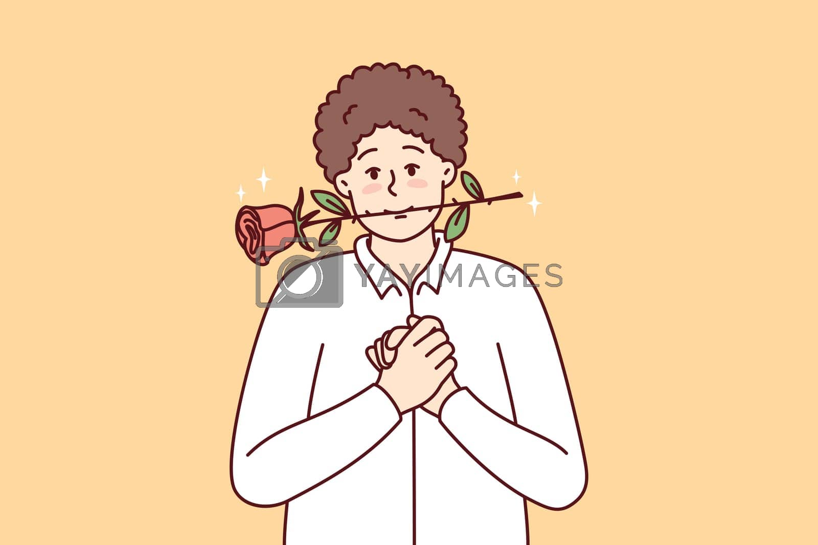 Royalty free image of Timid young guy with rose in mouth clenching palms in front of chest by Vasilyeva