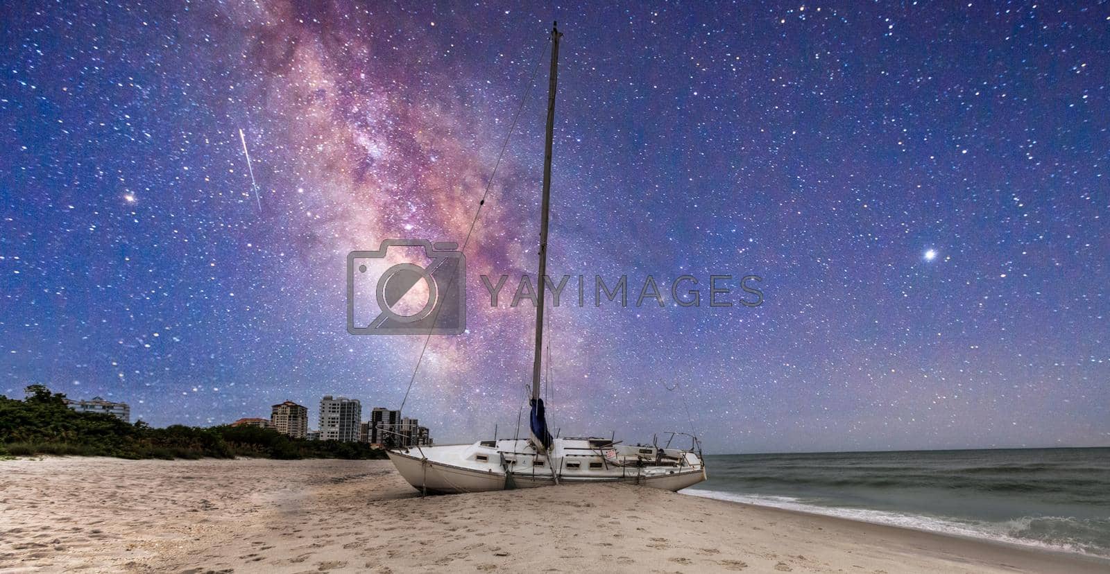 Royalty free image of Milky way in the night sky over a shipwreck off the coast of Clam Pass by steffstarr