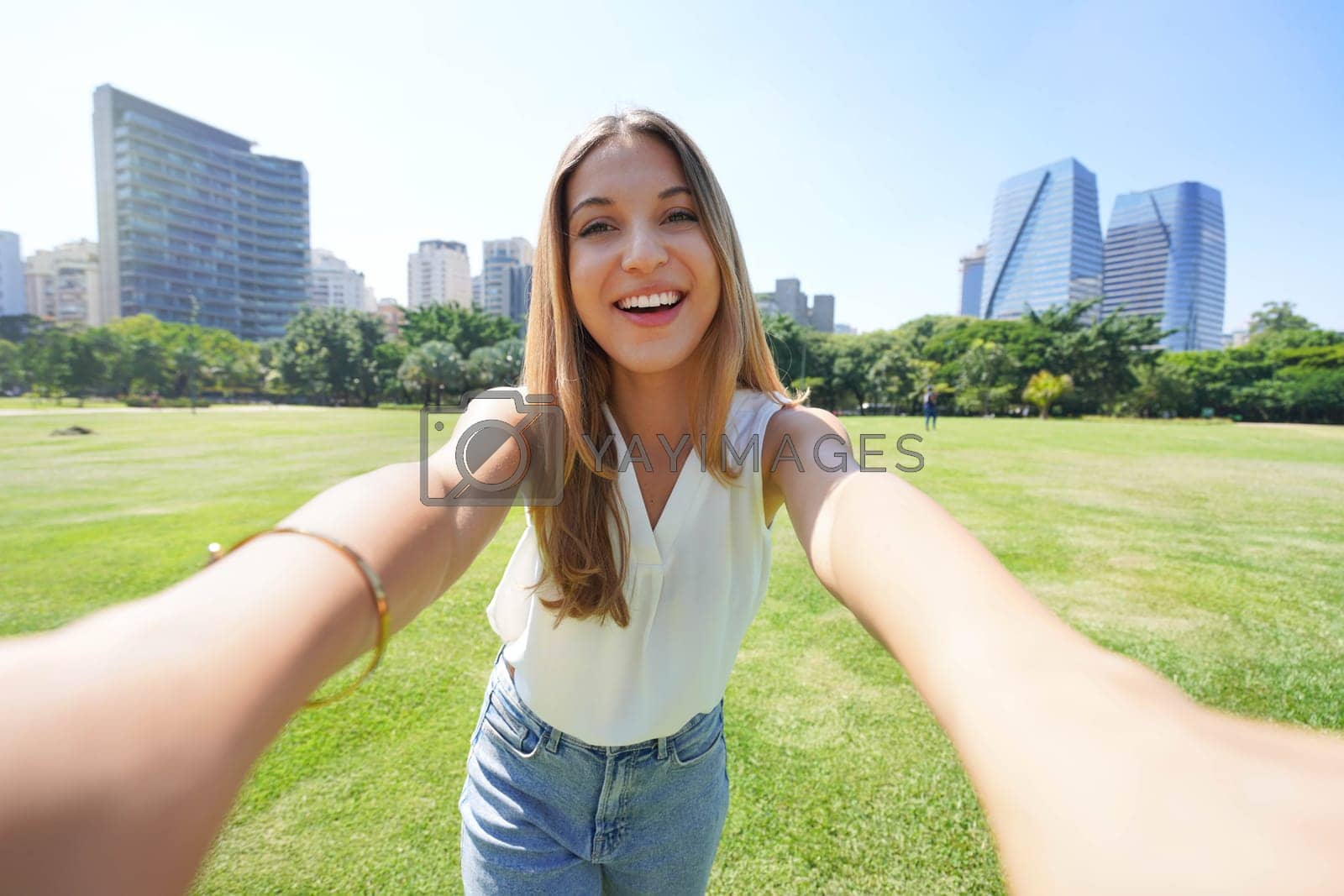 Royalty free image of Beautiful smiling girl takes self portrait in Sao Paulo, Brazil by sergio_monti