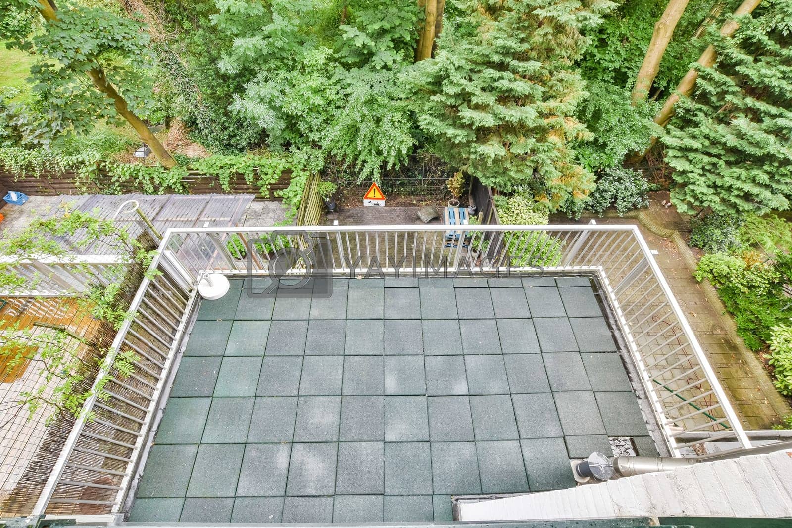 Royalty free image of an aerial view of a swimming pool with trees in by casamedia