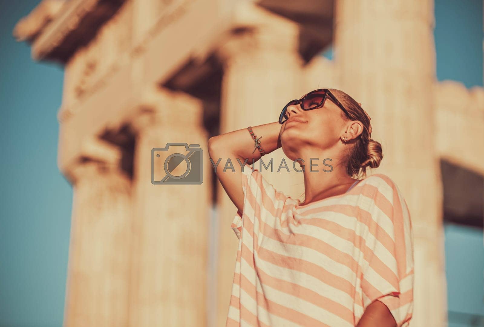 Royalty free image of Happy girl tourist visits Acropolis. Greece by Anna_Omelchenko
