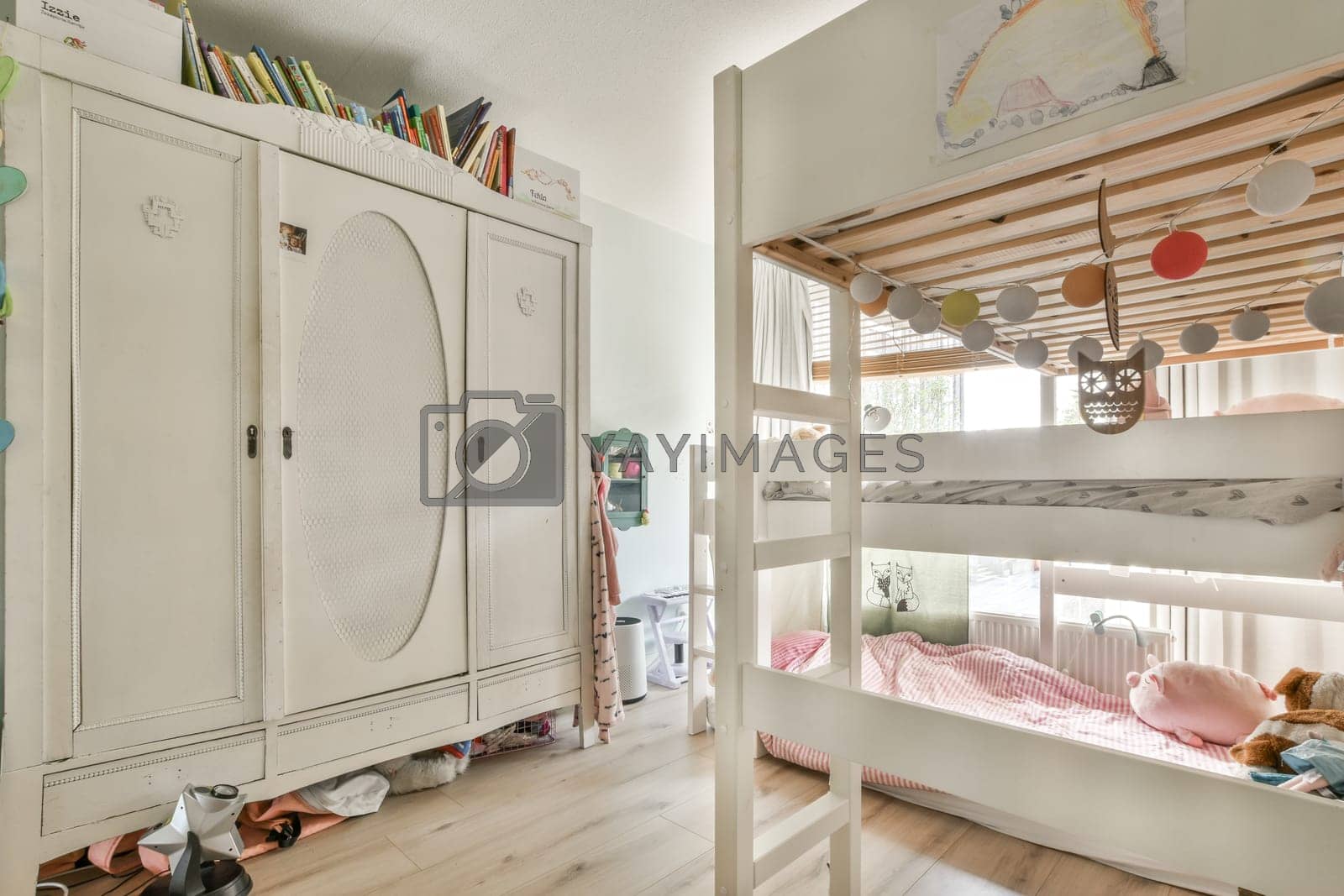 Royalty free image of a childrens bedroom with bunk beds and a wardrobe by casamedia