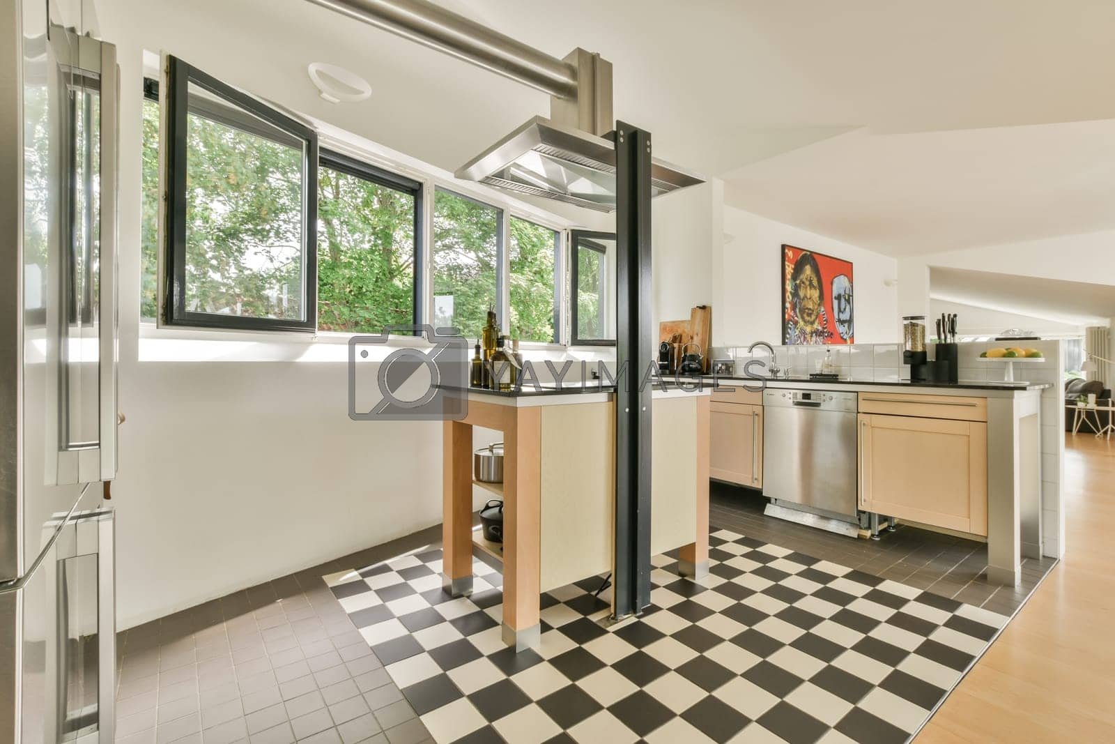 Royalty free image of a kitchen with checkered floors and a window by casamedia