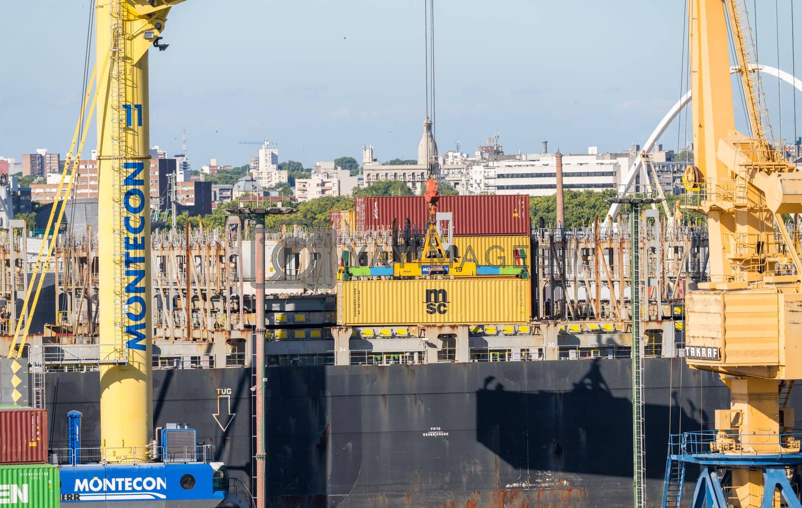 Royalty free image of Containers being loaded onto ship in Montevideo port Uruguay by steheap
