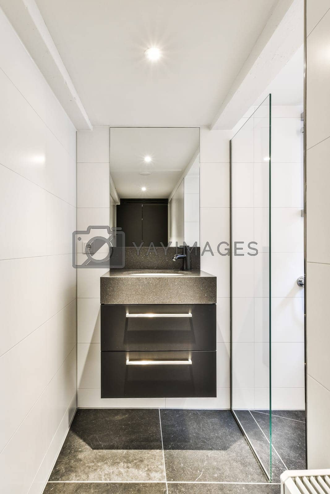 Royalty free image of a bathroom with a sink and a mirror by casamedia