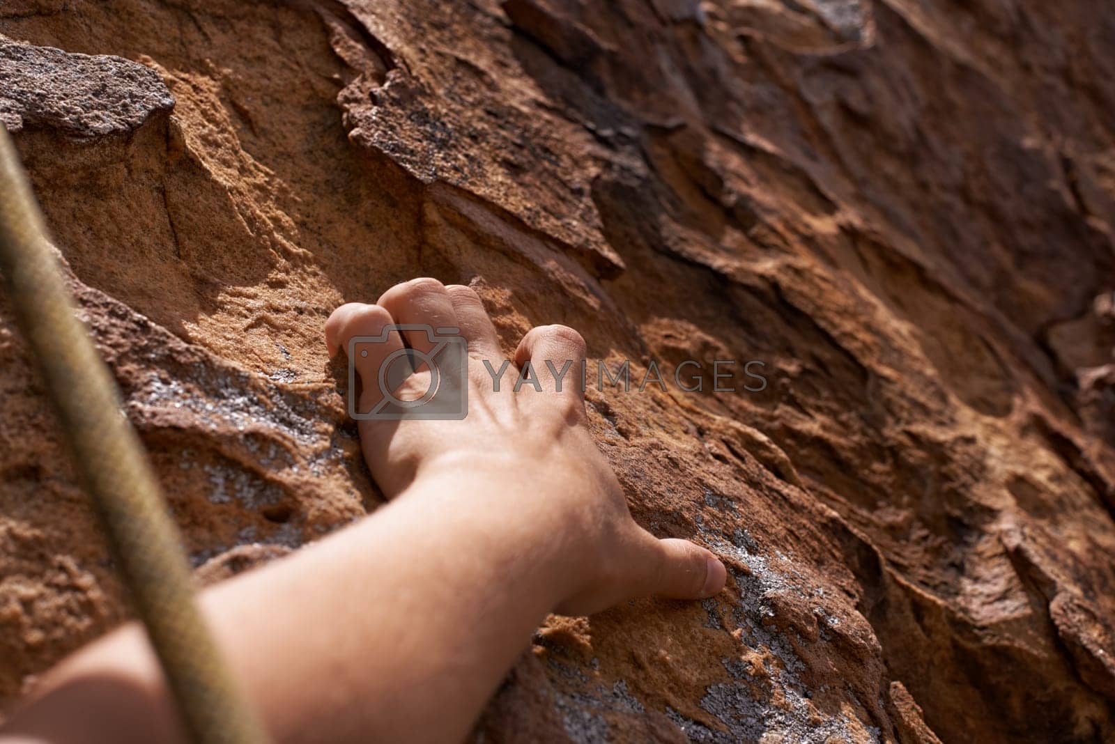 Royalty free image of Get a grip. Closeup of a rock climber holding on to a rockface. by YuriArcurs