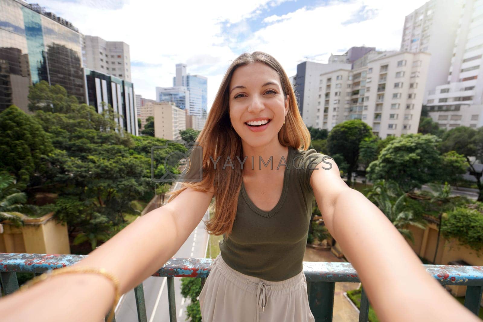 Royalty free image of Young beautiful Brazilian woman with stylish wears takes self portrait in Sao Paulo, Brazil by sergio_monti