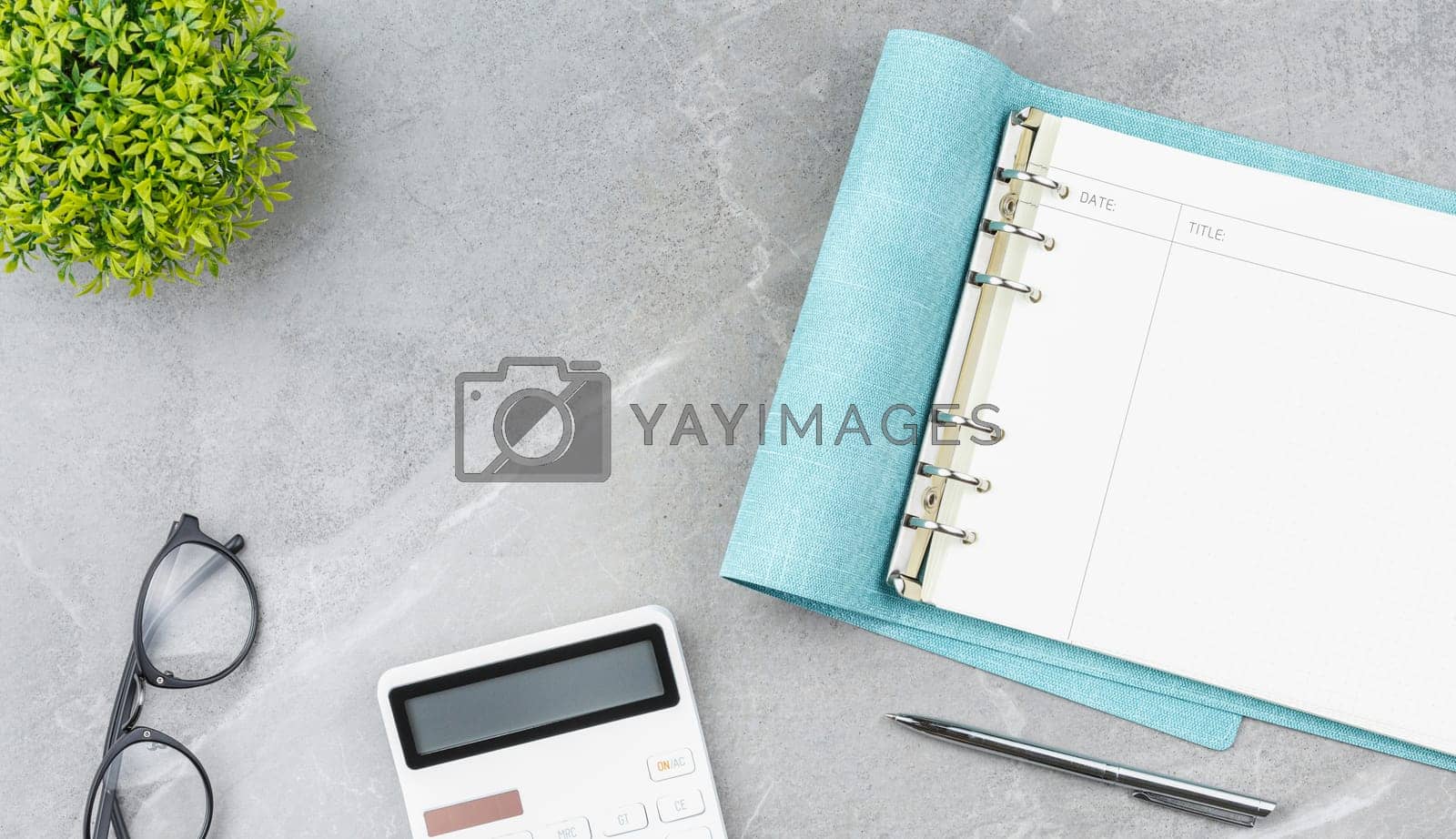 Royalty free image of Open blue notebook office desk. by alexxndr