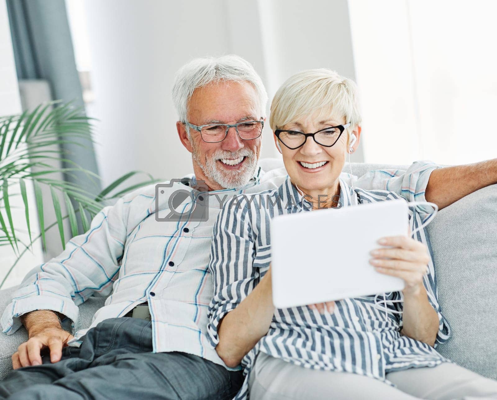 Royalty free image of senior couple happy tablet computer love together techology internet retirement online man woman elderly by Picsfive