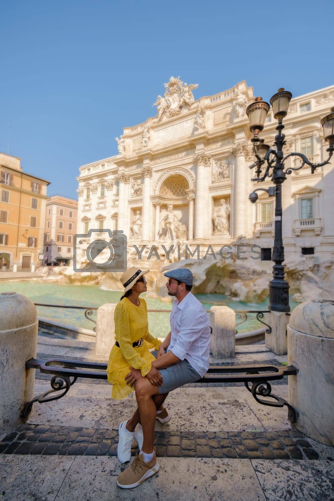 Royalty free image of Men and women at the Trevi Fountain, Rome, Italy. City trip Rome couple on a city trip in Rome. by fokkebok