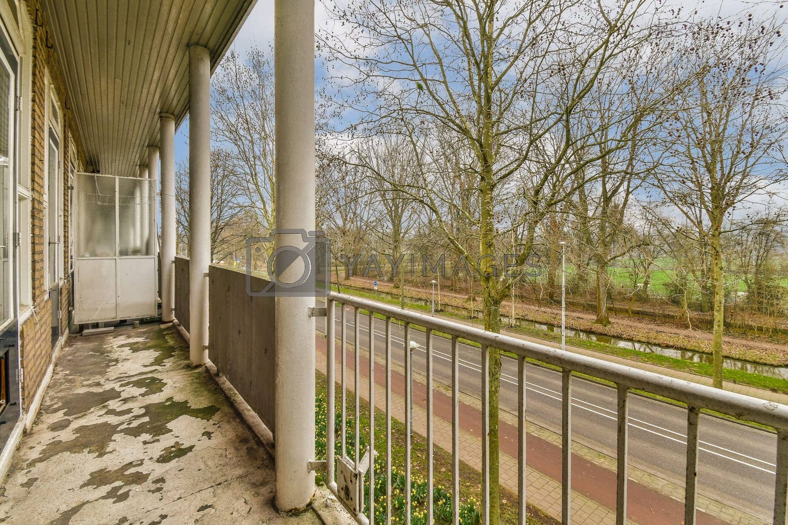 Royalty free image of the front porch of a building with a guard rail by casamedia