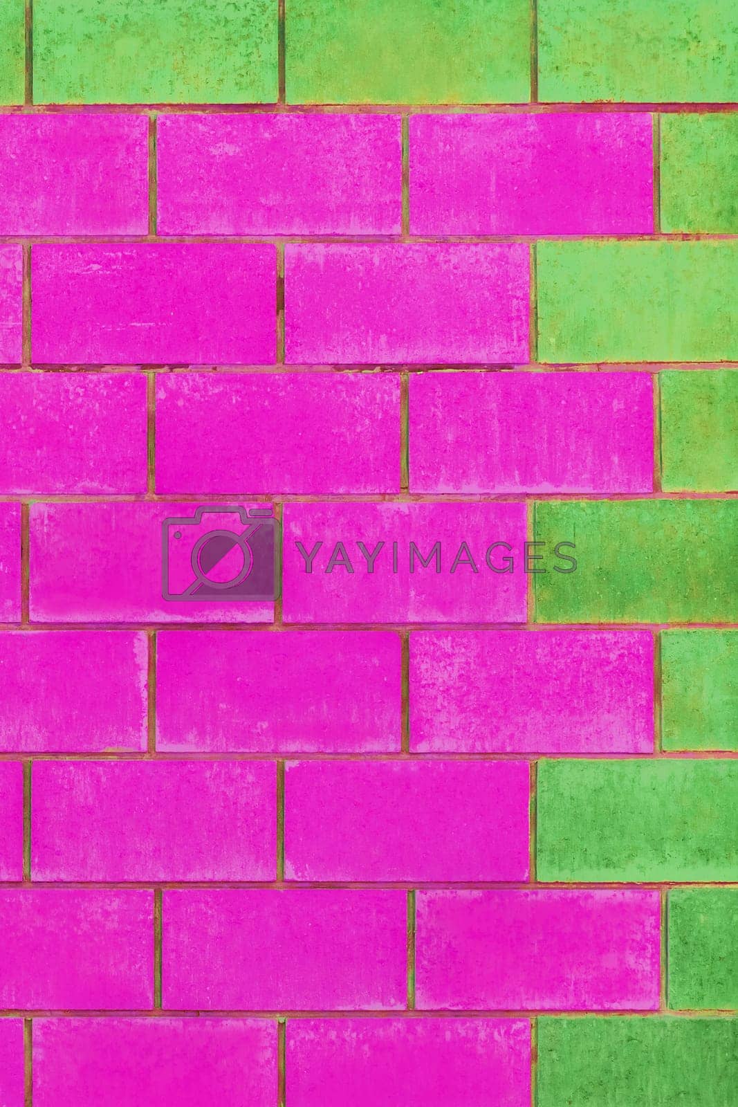 Royalty free image of Green and purple pink paint on brick blocks urban color vibrant design wall texture background architecture by AYDO8