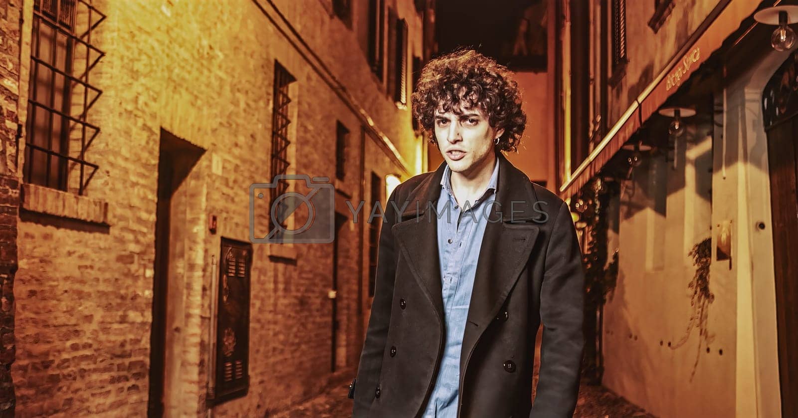 Royalty free image of Angry Young Man in Night Alley by pippocarlot