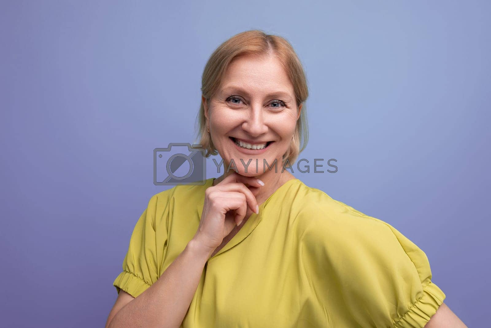Royalty free image of horizontal closeup of happy middle aged woman in casual outfit by TRMK
