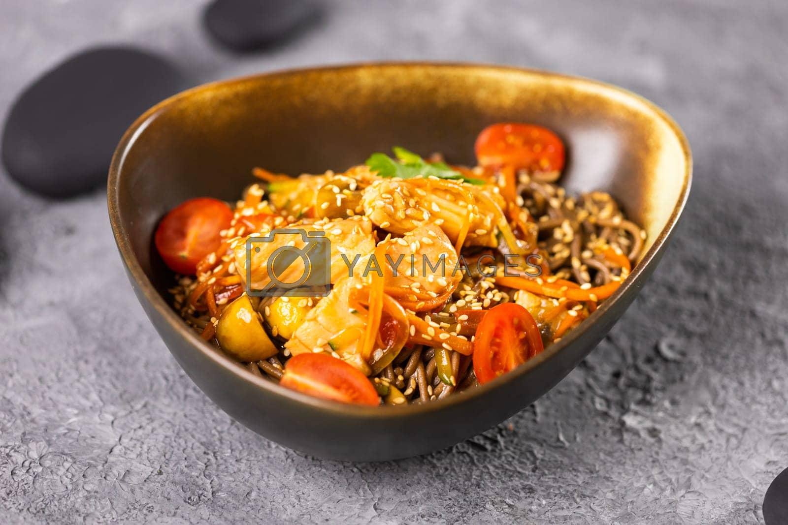 Royalty free image of Udon stir-fry noodles with salmon and vegetables. Asian cuisine by Satura86
