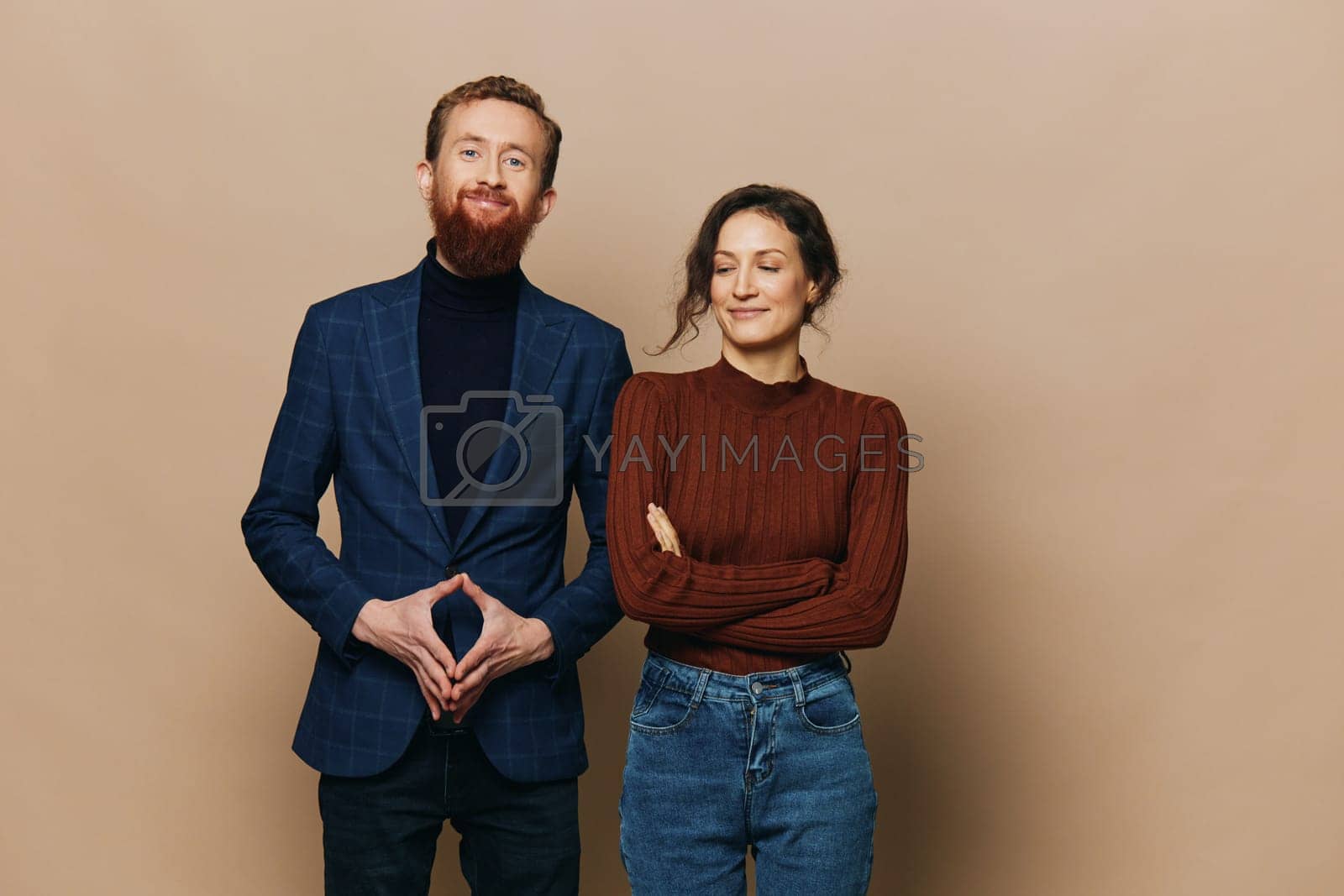 Royalty free image of Man and woman couple in a relationship smile and interaction on a beige background in a real relationship between people by SHOTPRIME