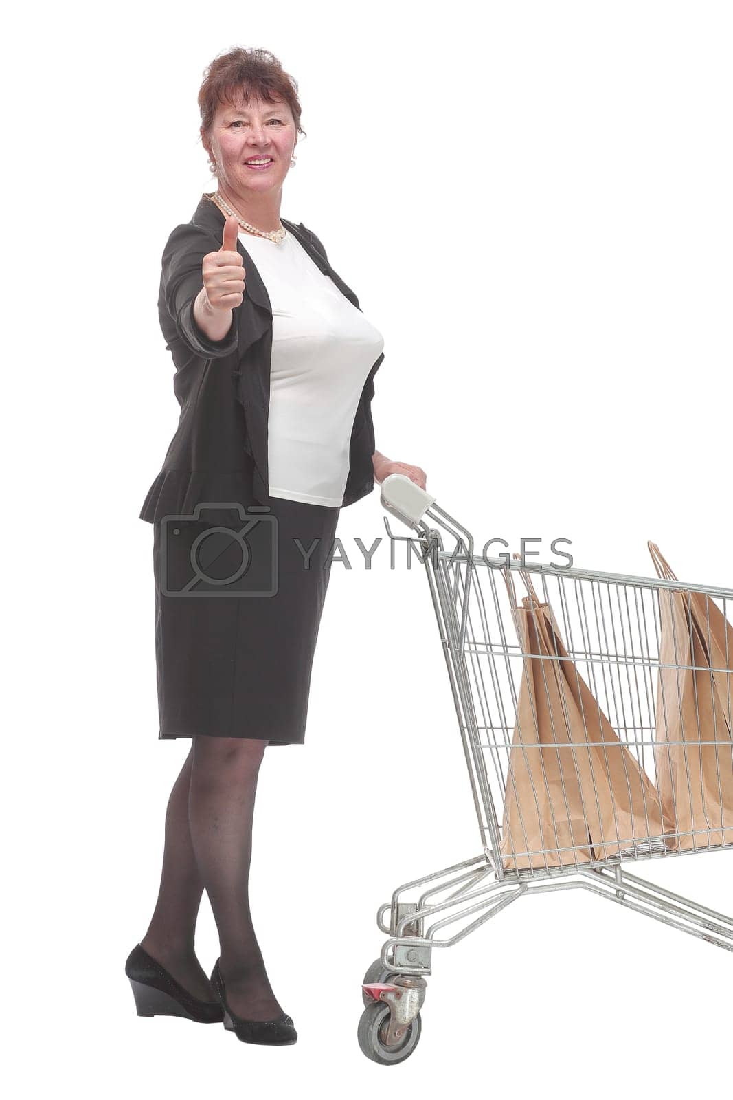 Royalty free image of Full length portrait of a woman pushing a shopping trolley by asdf