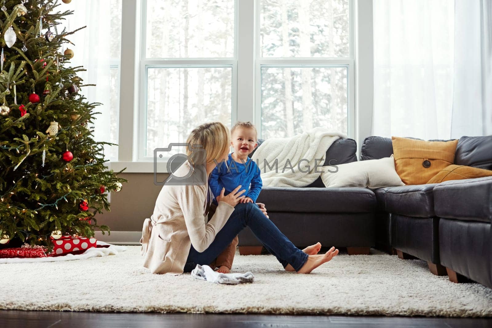 Royalty free image of We appreciate each others company. a happy young mother playing with her baby boy at home. by YuriArcurs