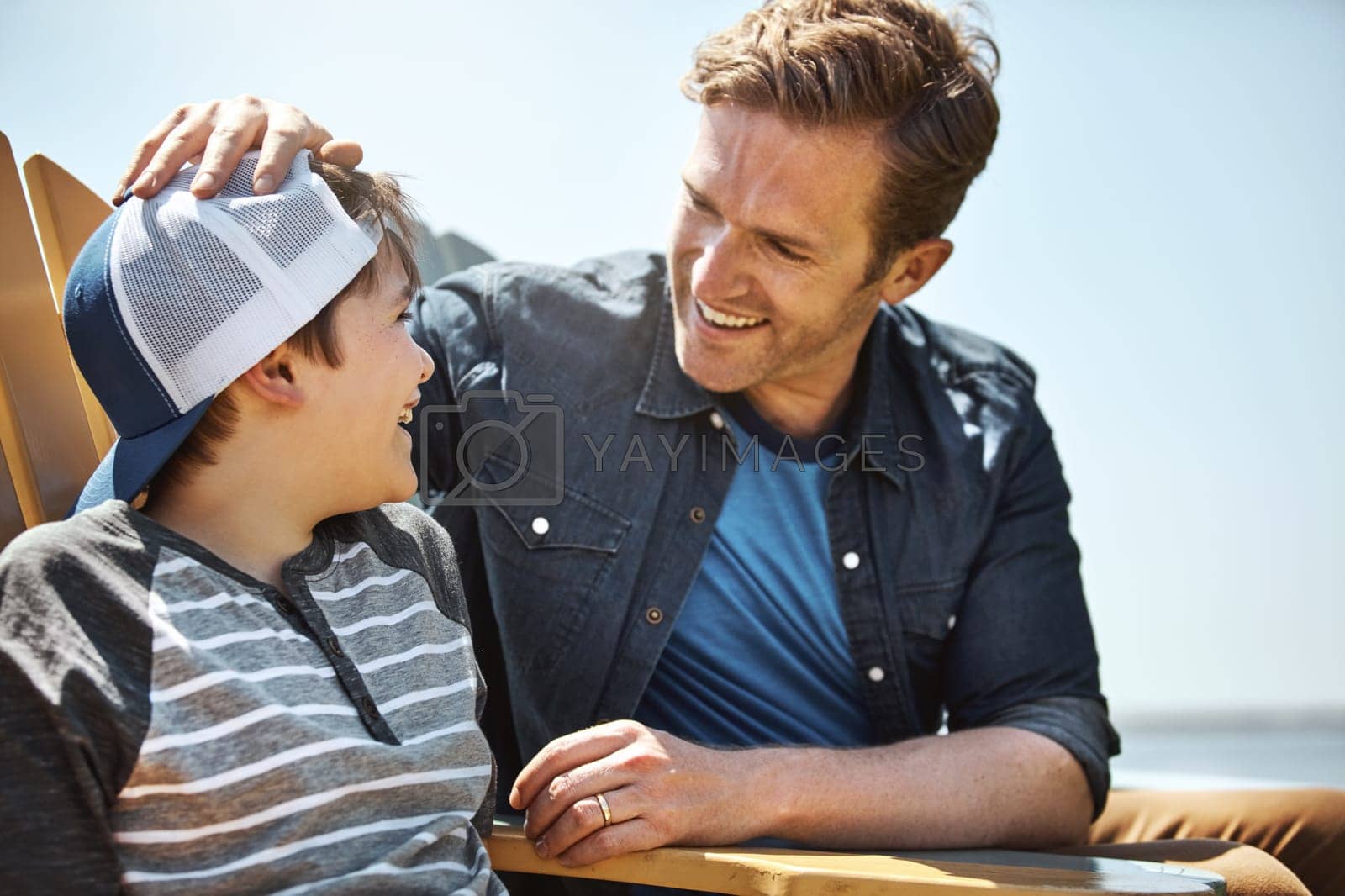 Royalty free image of Dad has always been his role model. a father bonding with his little son outdoors. by YuriArcurs
