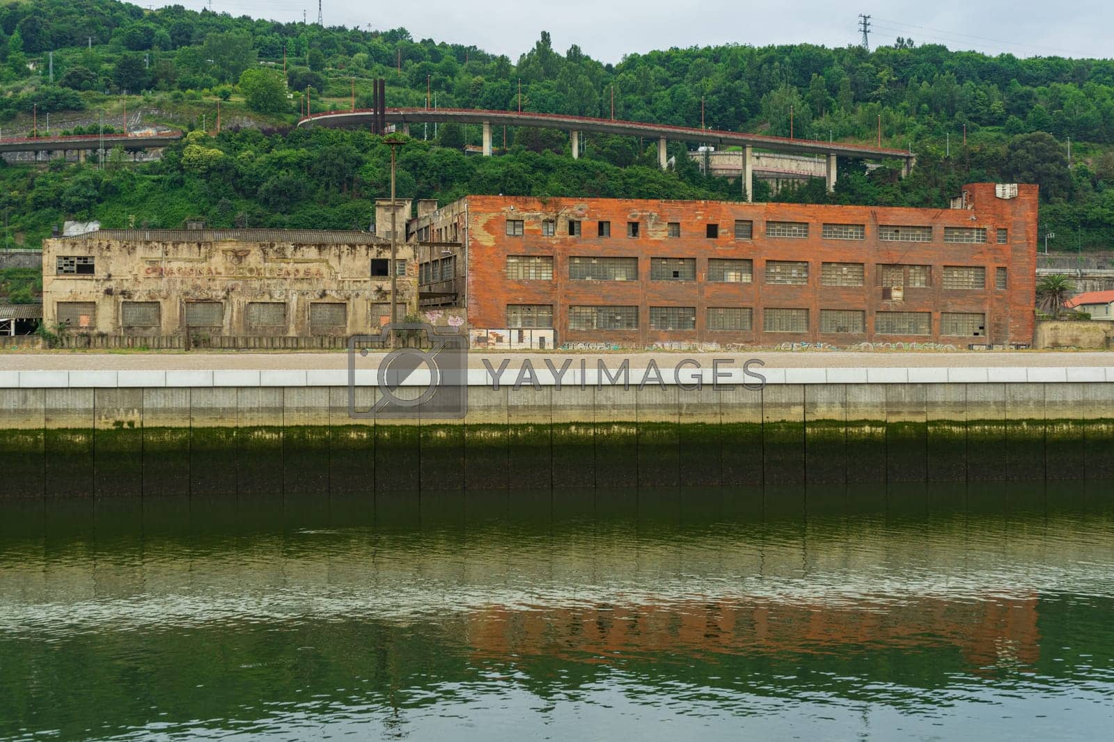 Royalty free image of Abandoned industrial buildings along the Nervion River, Bilbao Basque Country, Spain. by paca-waca