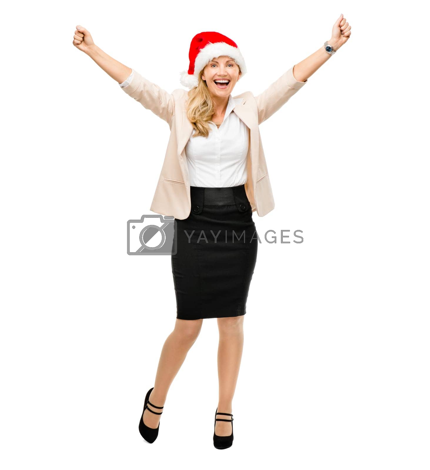 Royalty free image of Christmas is just around the corner. a senior businesswoman wearing a christmas hat cheering against a studio background. by YuriArcurs