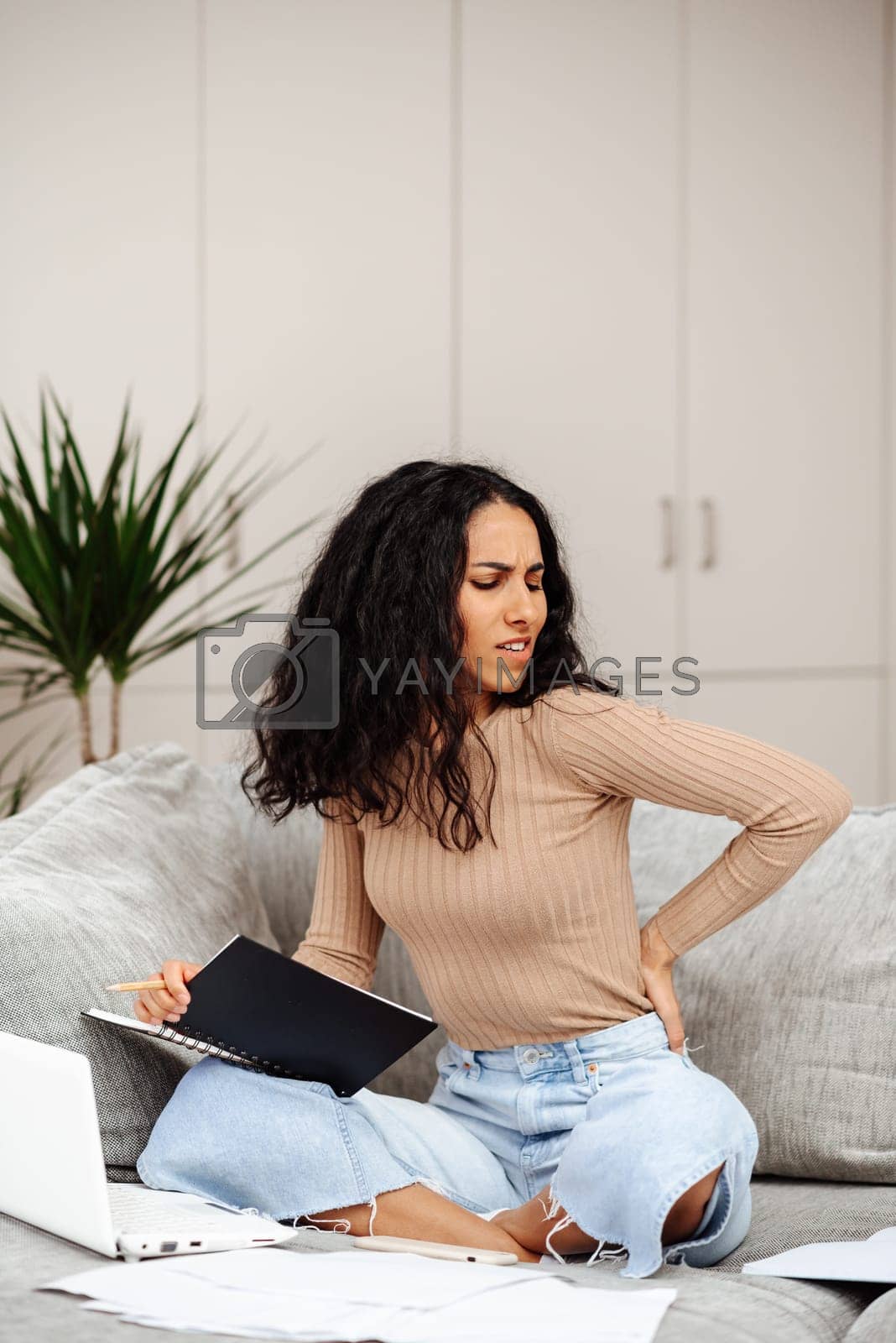 Royalty free image of Healthcare concept. Poor posture and pain at work. by SistersStock