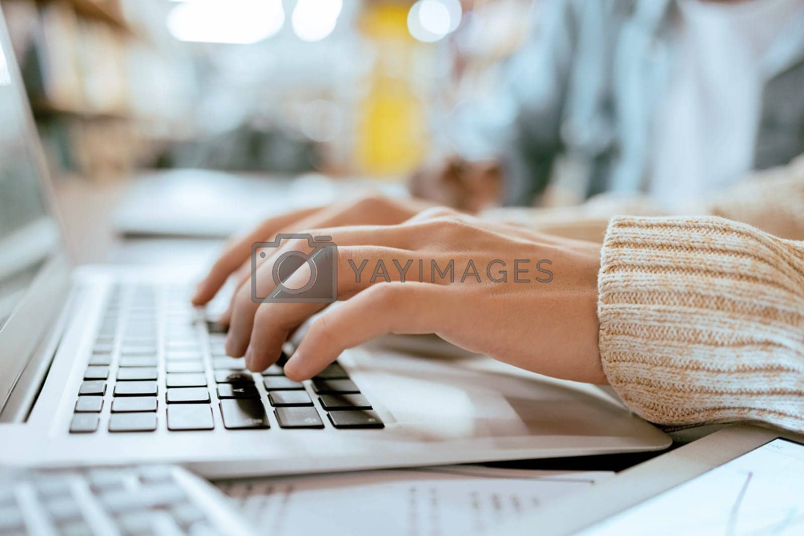 Royalty free image of Closeup, student hands and typing on laptop at desk for studying, planning and learning for goals. Man, keyboard and computer for brainstorming and online research for ideas at university library by YuriArcurs