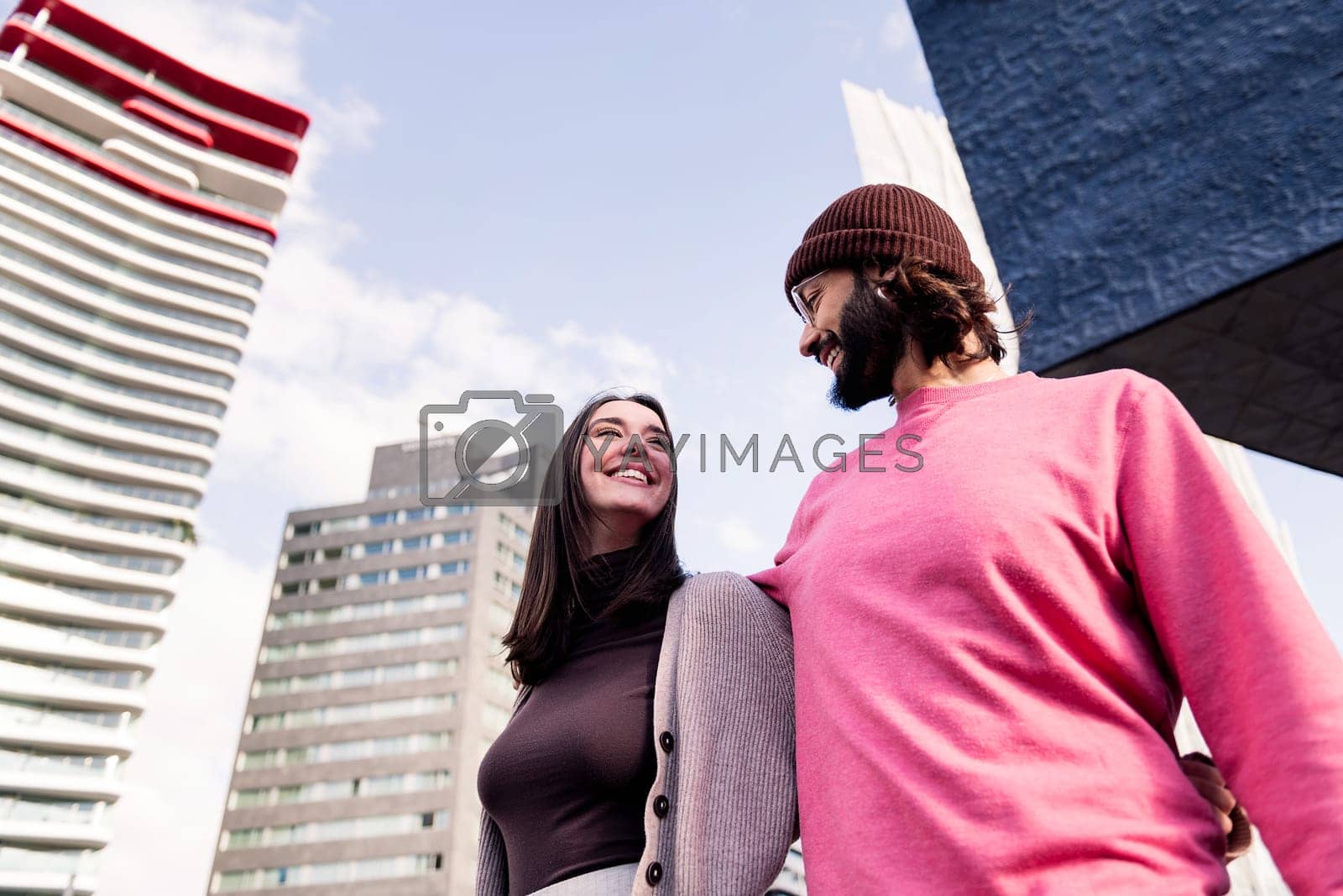 Royalty free image of affectionate young couple smiling on romantic walk by raulmelldo