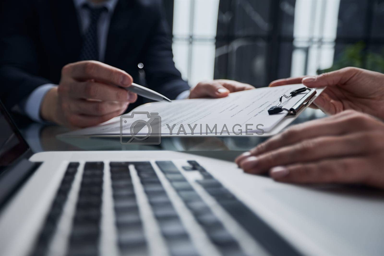Royalty free image of agents are explain to customers signing a contract to buy a new home. by Prosto