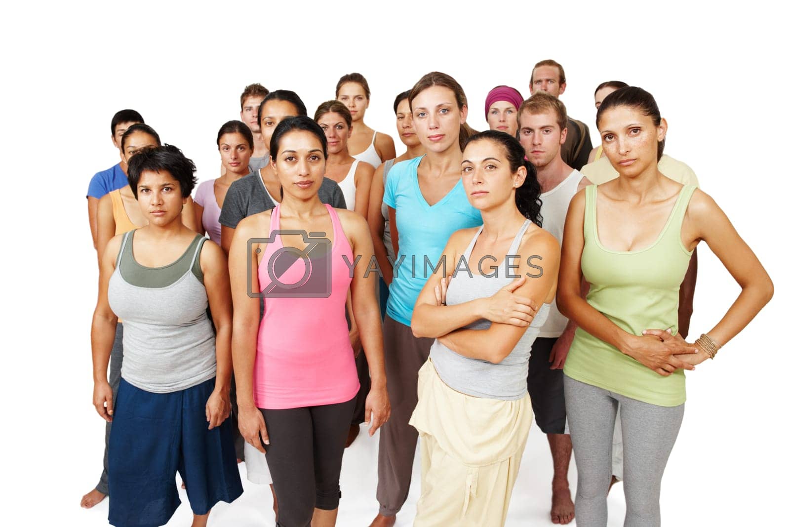 Royalty free image of Theyre serious about yoga fitness. A serious and focused yoga class standing together on a white background. by YuriArcurs