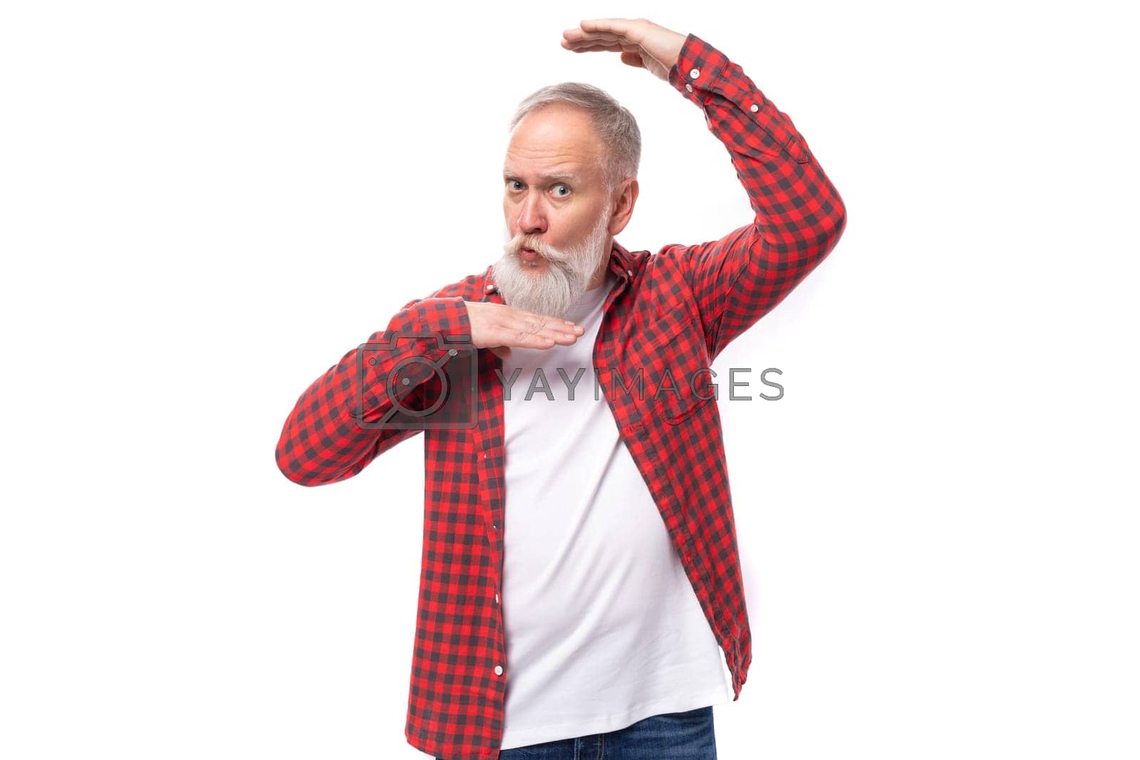 Royalty free image of handsome 60s middle aged mature man in stylish shirt makes a face by TRMK