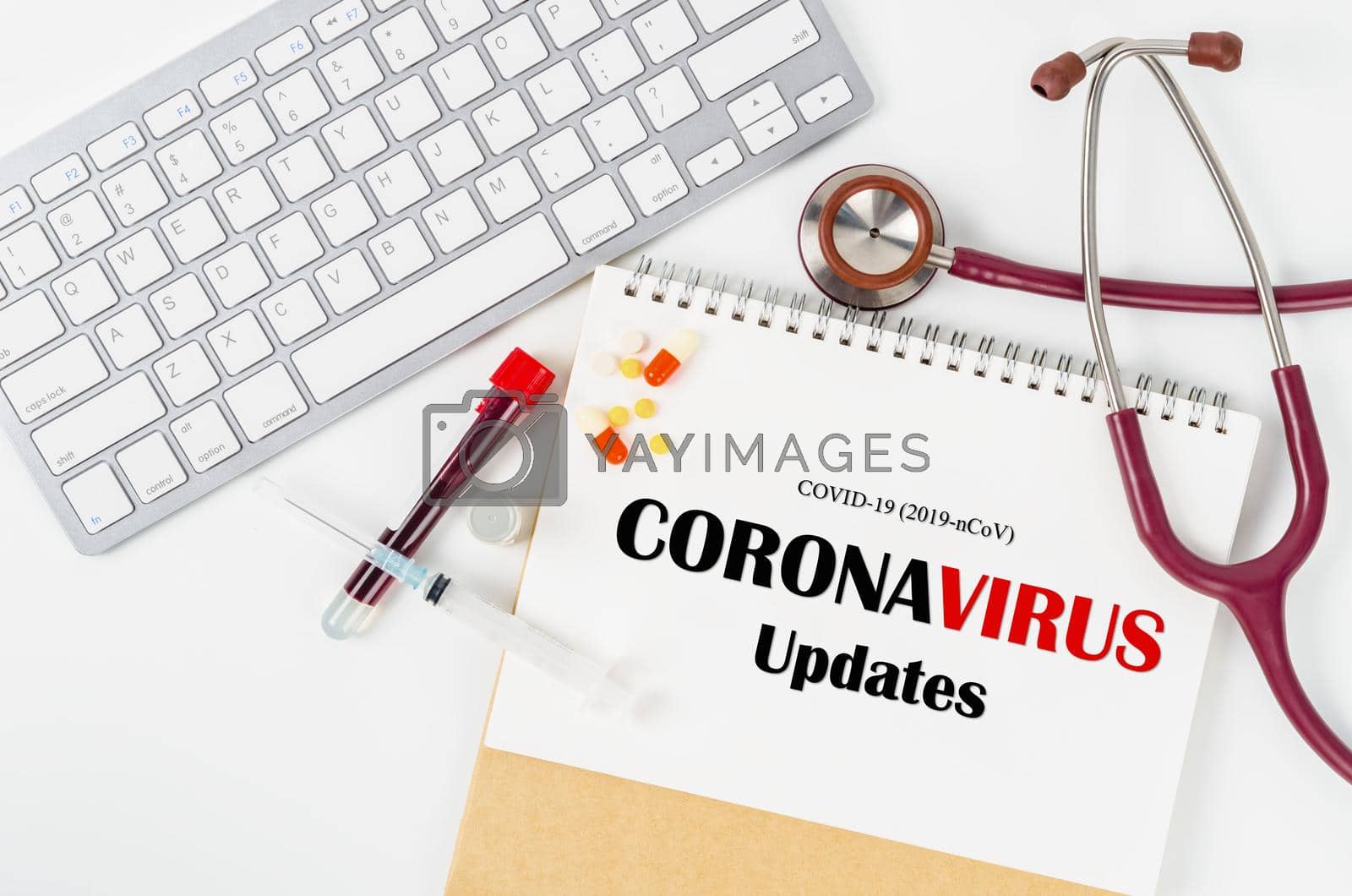 Royalty free image of CORONAVIRUS UPDATES and vaccine vial with sample blood in tube for test in laboratory. by Gamjai