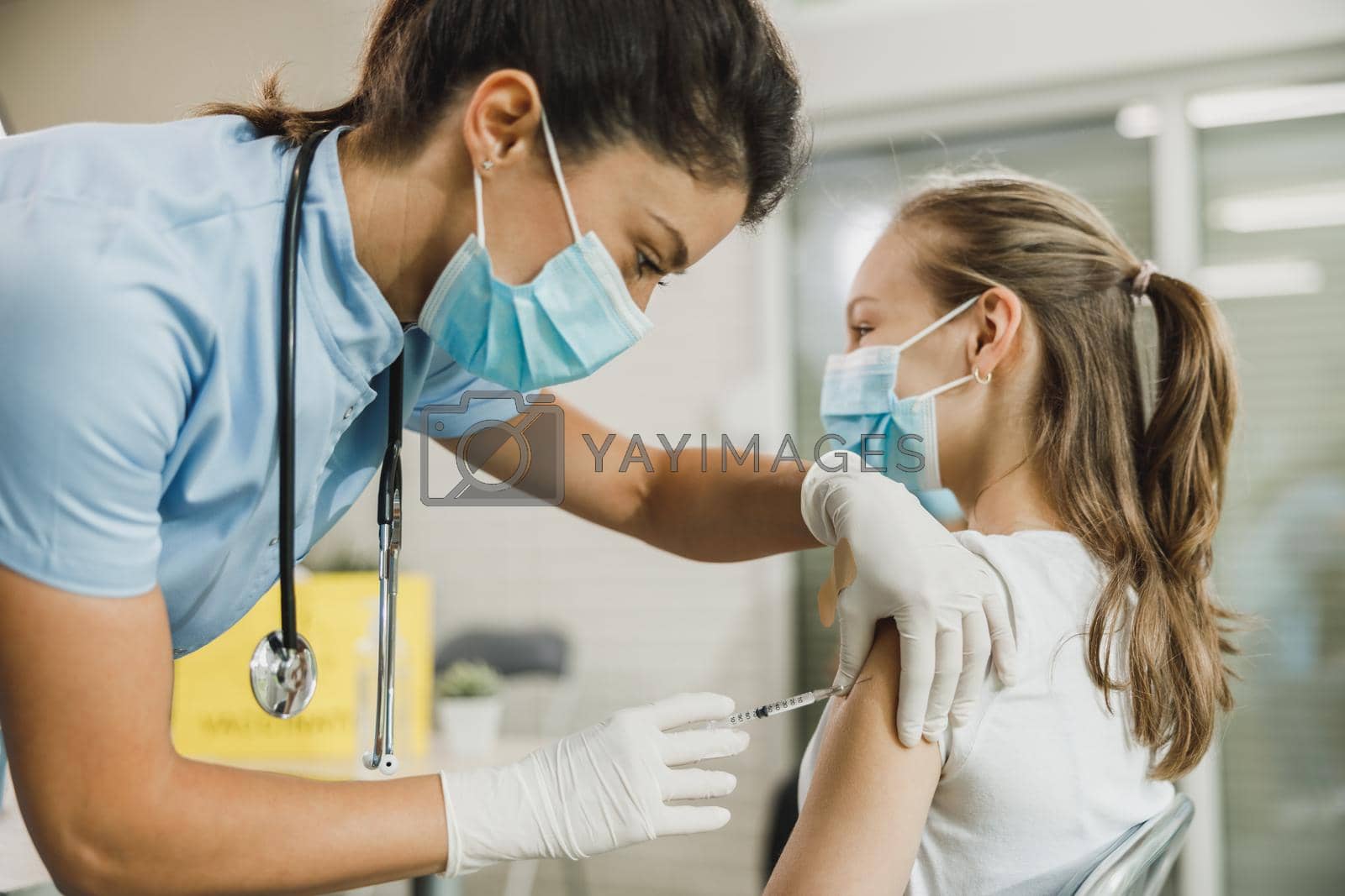 Royalty free image of Teenager Girl Getting Vaccinated Due To Covid-19 by MilanMarkovic78