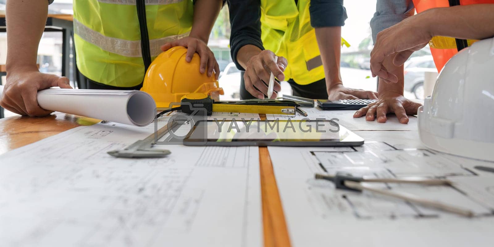 Royalty free image of engineer team working in office with blueprints, inspection in workplace for architectural plan, construction project ,Business construction by nateemee