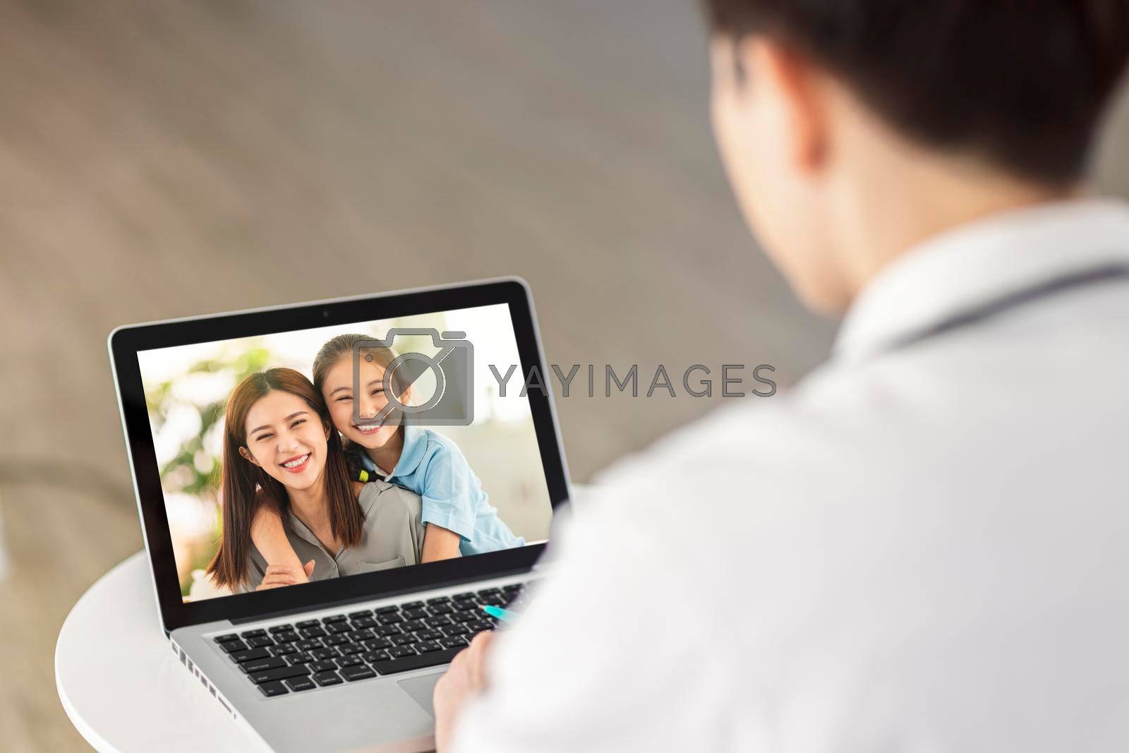 Royalty free image of Man having video chat with friends and family using laptop. by tomwang