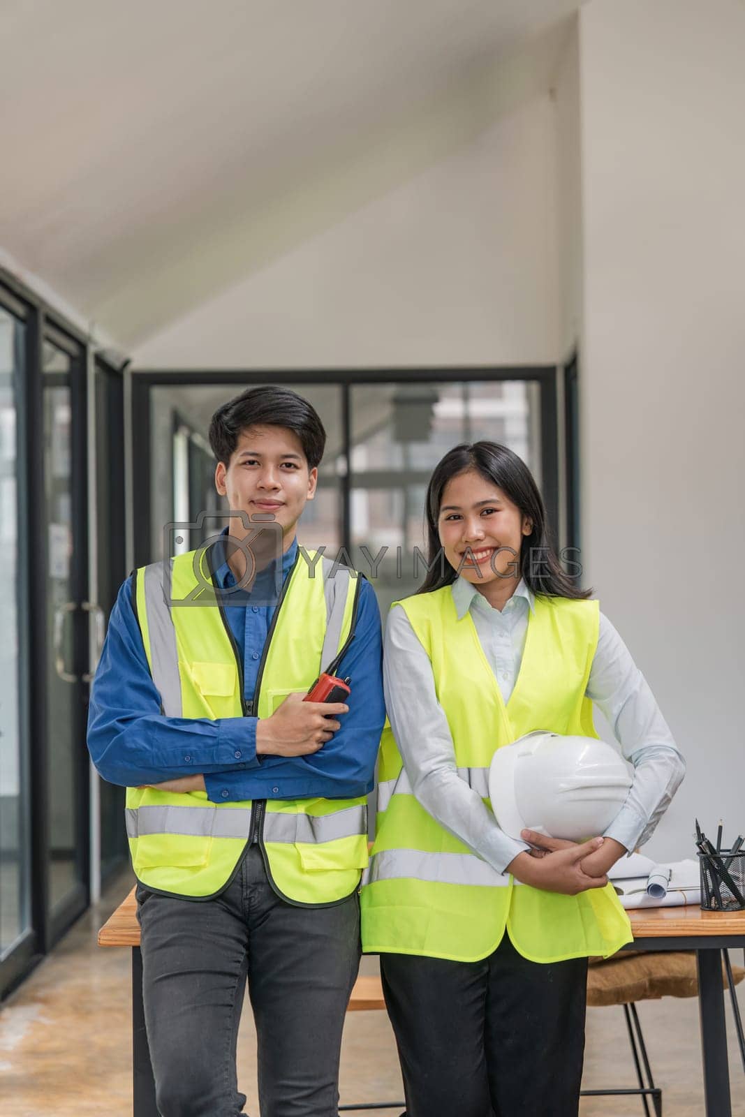 Royalty free image of Portrait two engineer asian smileing building contractors standing at office by nateemee