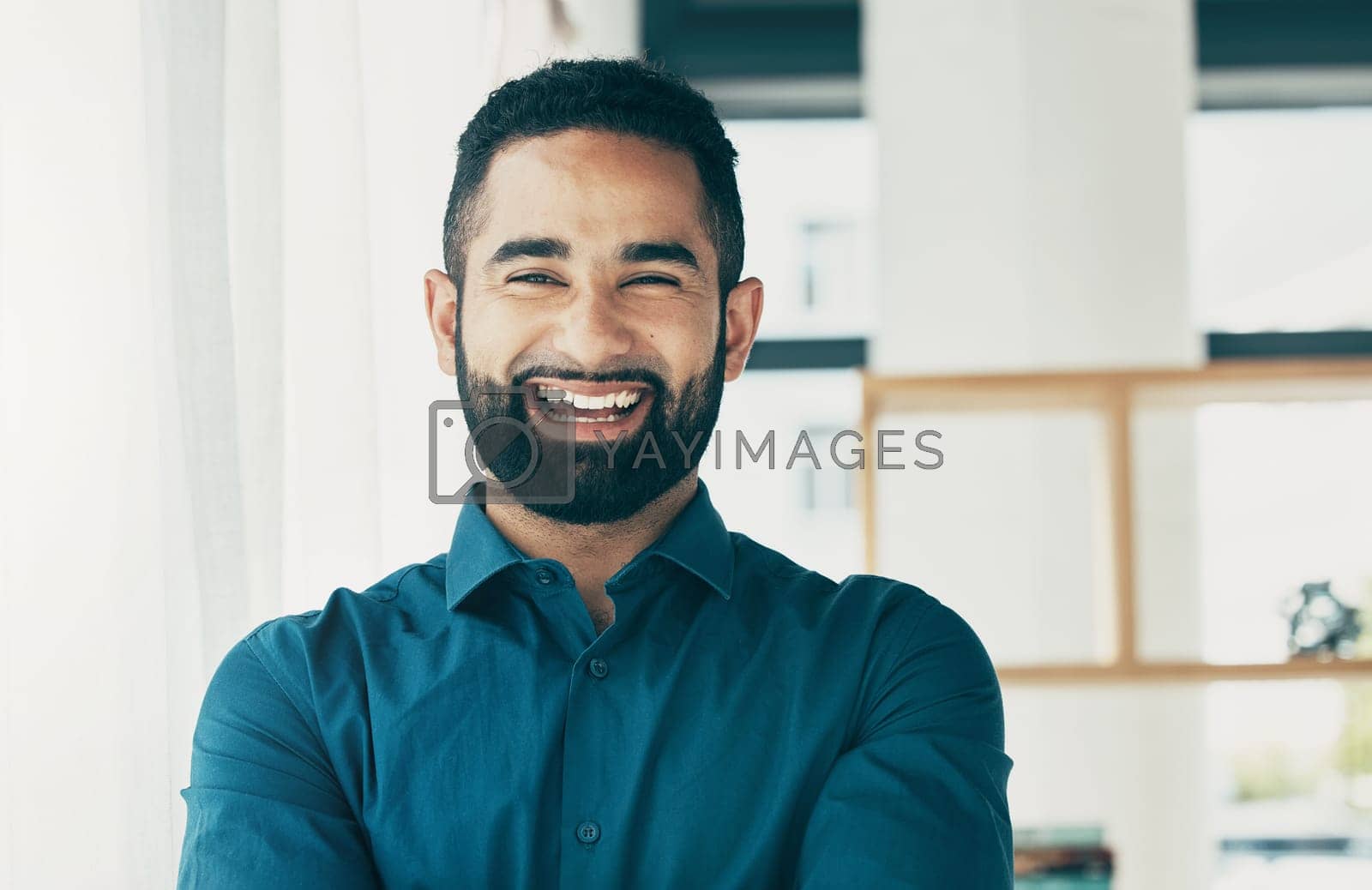Royalty free image of Laughing, happy and portrait of a businessman in an office with confidence for a corporate career. Smile, professional and headshot of a male employee in the workplace as a lawyer or attorney by YuriArcurs