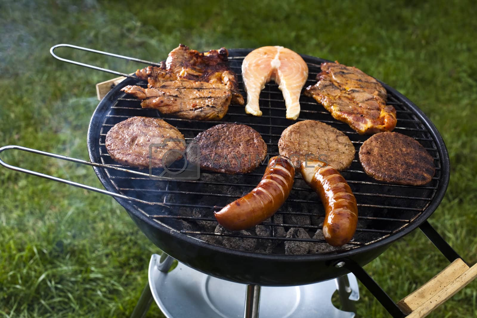 Royalty free image of Barbecue a hot summer evening, Grilling by JanPietruszka