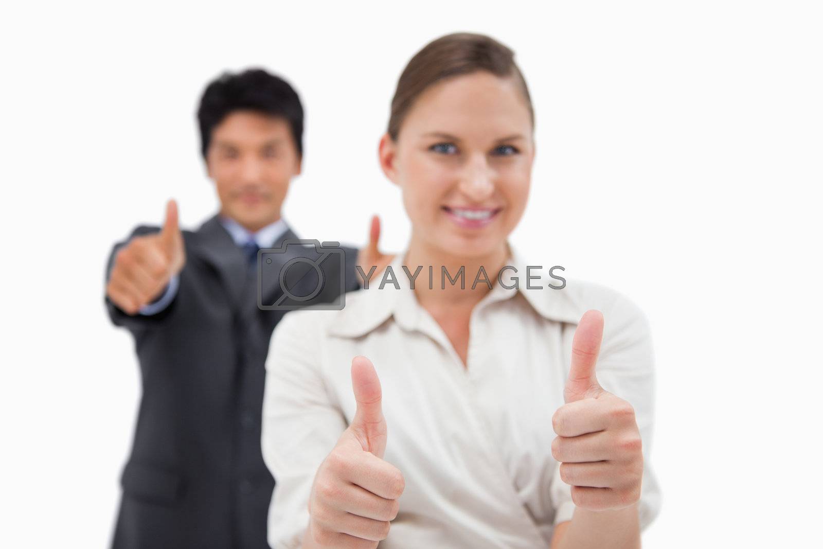 Royalty free image of Smiling business people with the thumbs up by Wavebreakmedia